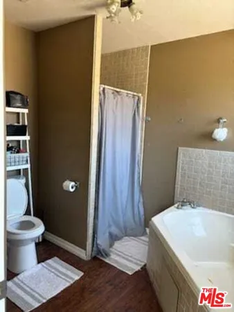 a bathroom with a sink and toilet