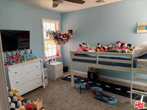 a room with furniture and a flat screen tv