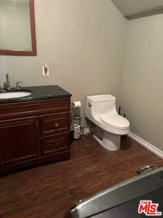 a bathroom with a toilet and a sink