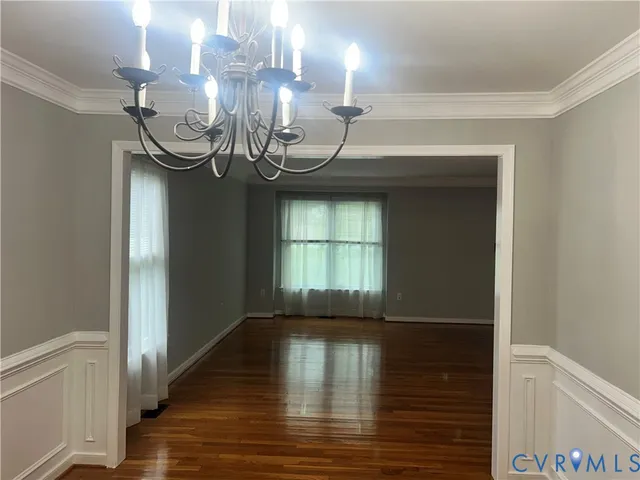 a bathroom with a tub a sink and a mirror