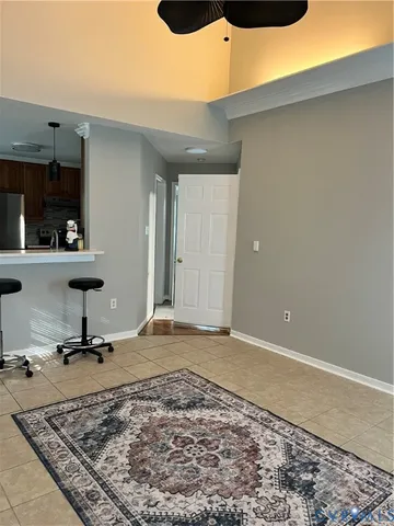a white toilet sitting next to a bathroom sink and vanity