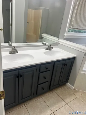 an empty room with a ceiling fan and a window