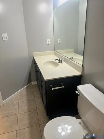 a view of a hallway with a black and white checkered floor