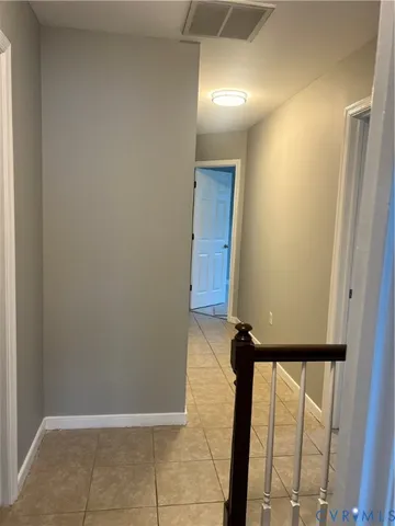 a kitchen with granite countertop a refrigerator and a sink