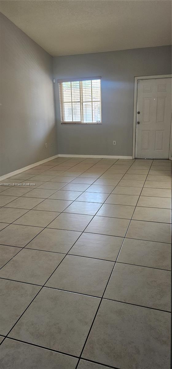 2910 Southeast 12th Road, Unit 20429 Homestead, FL 33035 - Photo 2 of 16 a view of an empty room and window