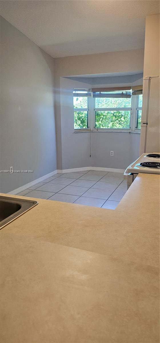 2910 Southeast 12th Road, Unit 20429 Homestead, FL 33035 - Photo 7 of 16 a view of an empty room with a window