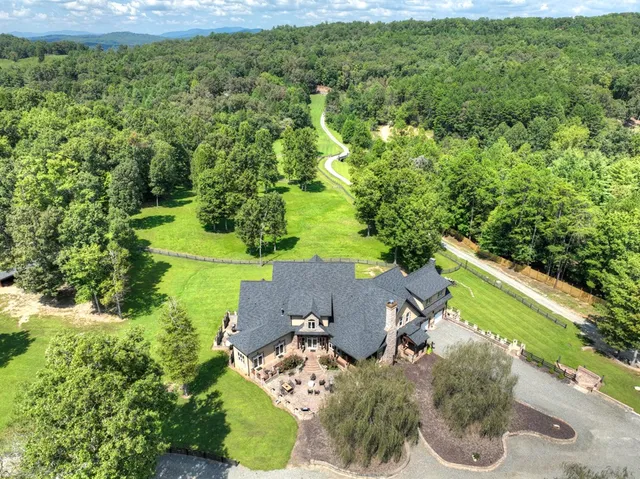 a kitchen with stainless steel appliances kitchen island granite countertop a stove and cabinets