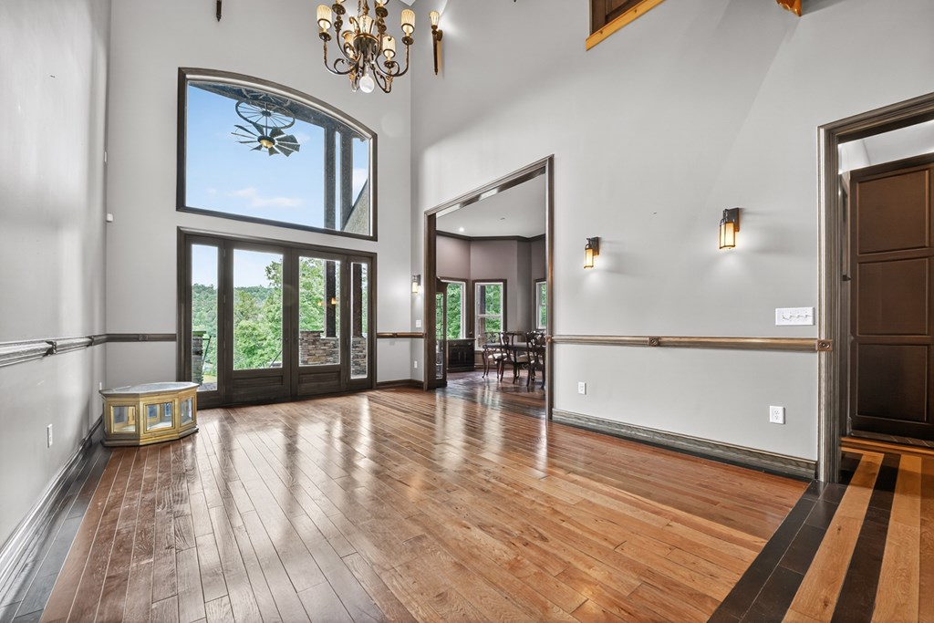 280 Star Creek Crossing Morganton, GA 30560 - Photo 15 of 100 a view of empty room with wooden floor and fan