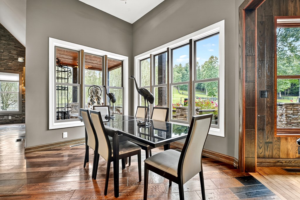 280 Star Creek Crossing Morganton, GA 30560 - Photo 17 of 100 a view of a dining room with furniture large windows and wooden floor