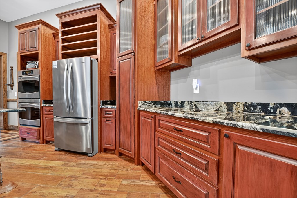 280 Star Creek Crossing Morganton, GA 30560 - Photo 23 of 100 a kitchen with stainless steel appliances granite countertop a refrigerator and a sink