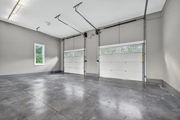 a dining room with furniture a window and wooden floor