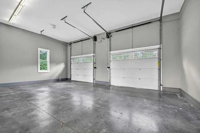 a dining room with furniture a window and wooden floor