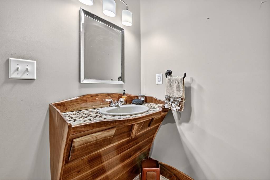 280 Star Creek Crossing Morganton, GA 30560 - Photo 35 of 100 a bathroom with a sink a mirror and vanity