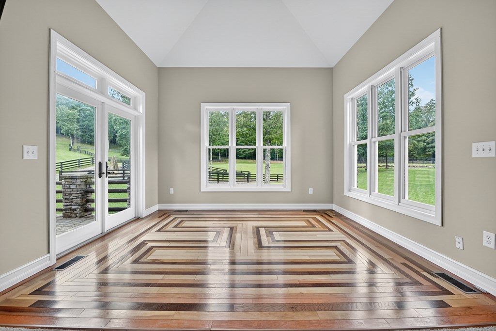 280 Star Creek Crossing Morganton, GA 30560 - Photo 37 of 100 a view of an empty room with wooden floor and a window
