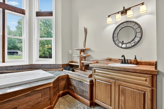 a view of a room with wooden floor and windows