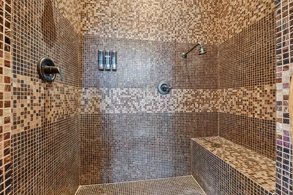 a bathroom with a sink vanity and a mirror