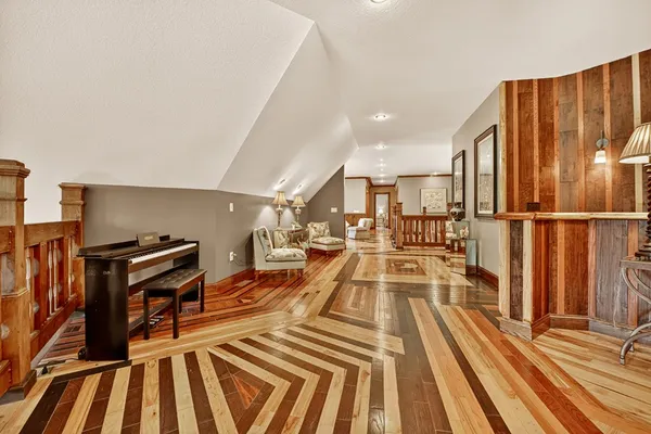 an aerial view of a house with a yard patio and fire pit