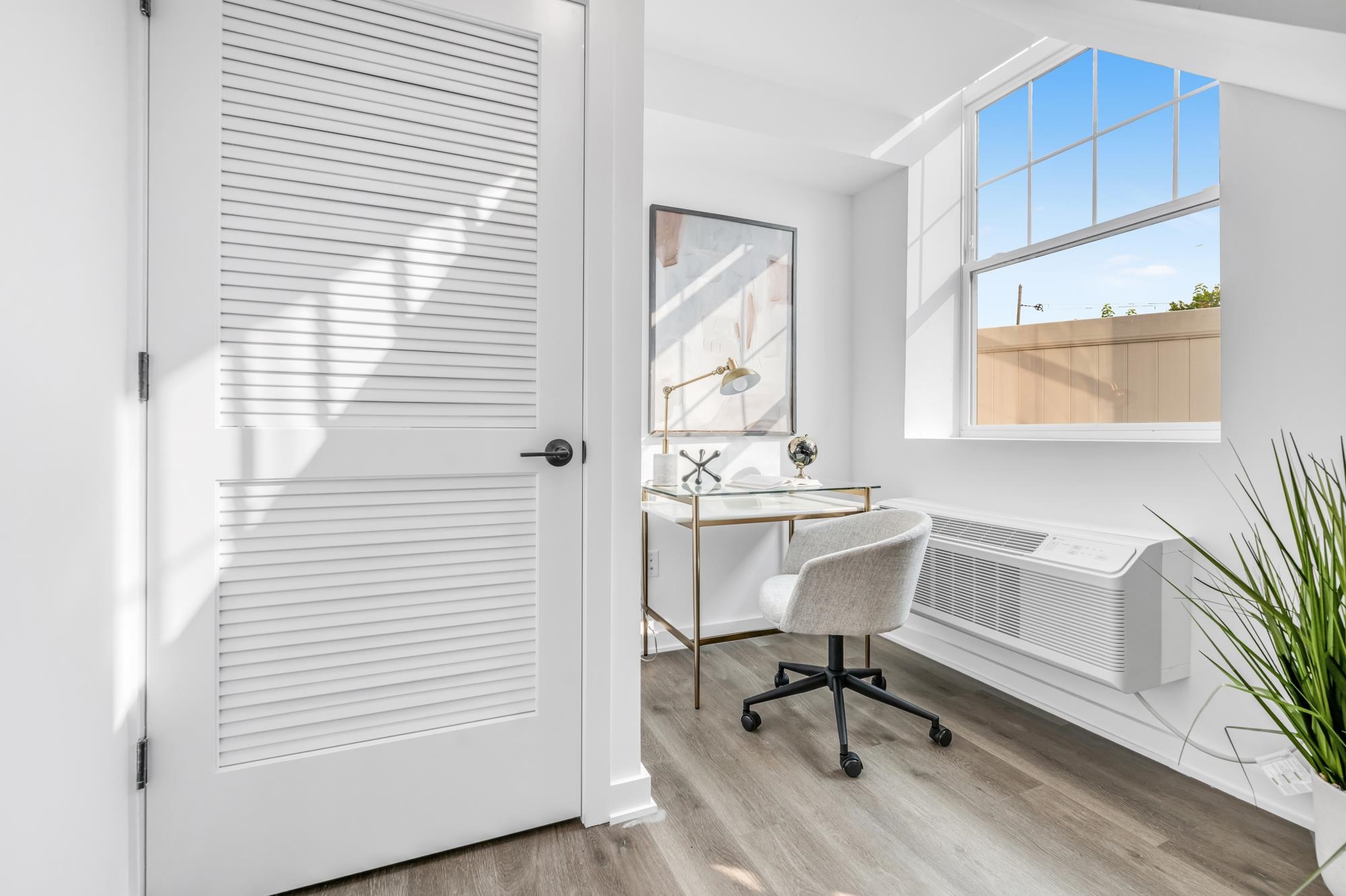 315 Railroad Avenue, Unit 108 East Rutherford, NJ 07073 - Photo 12 of 28 a view of a workspace with furniture and a window
