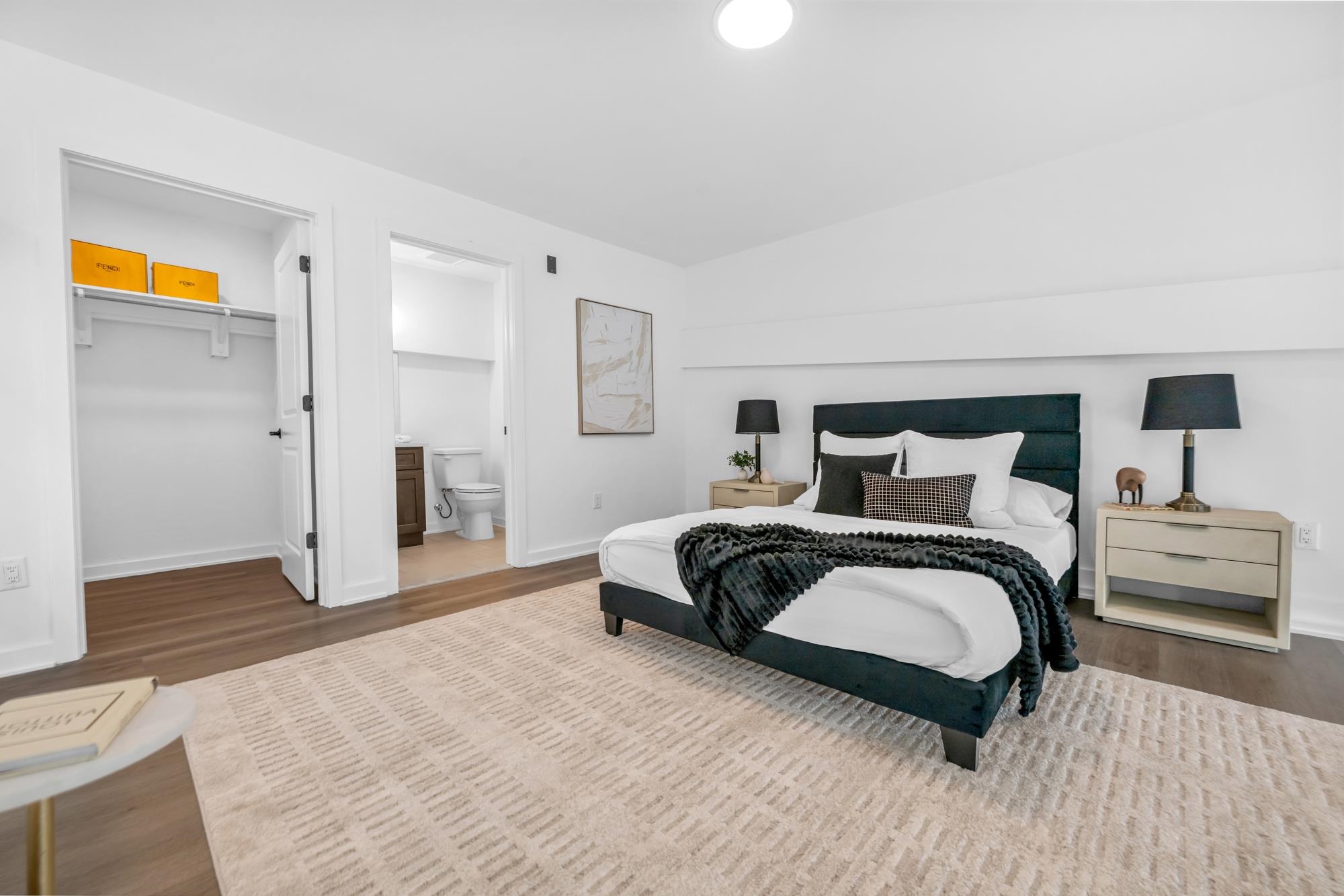 315 Railroad Avenue, Unit 108 East Rutherford, NJ 07073 - Photo 14 of 28 a bedroom with a bed and a view of living room