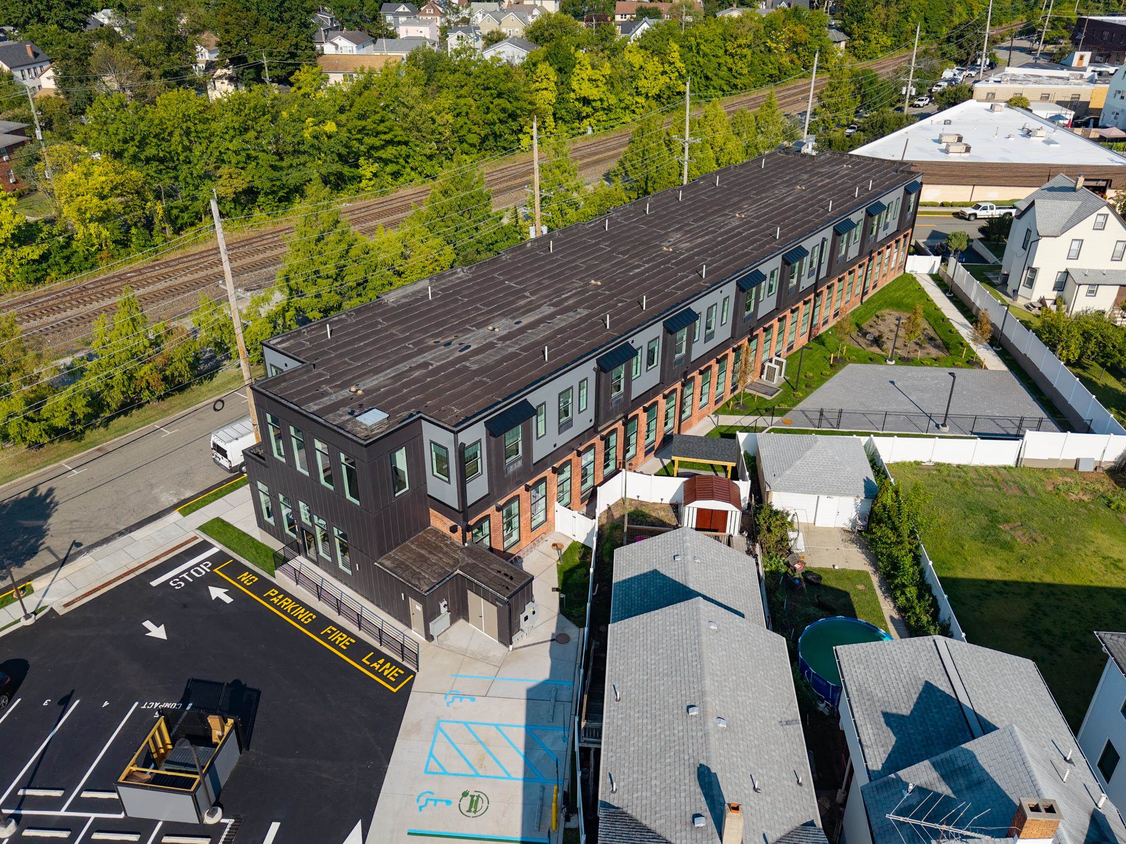 315 Railroad Avenue, Unit 108 East Rutherford, NJ 07073 - Photo 27 of 28 an aerial view of a house with a big yard