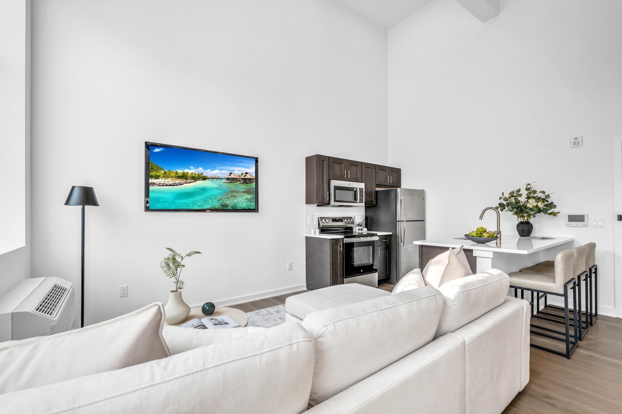 315 Railroad Avenue, Unit 108 East Rutherford, NJ 07073 - Photo 5 of 28 a living room with furniture and a flat screen tv