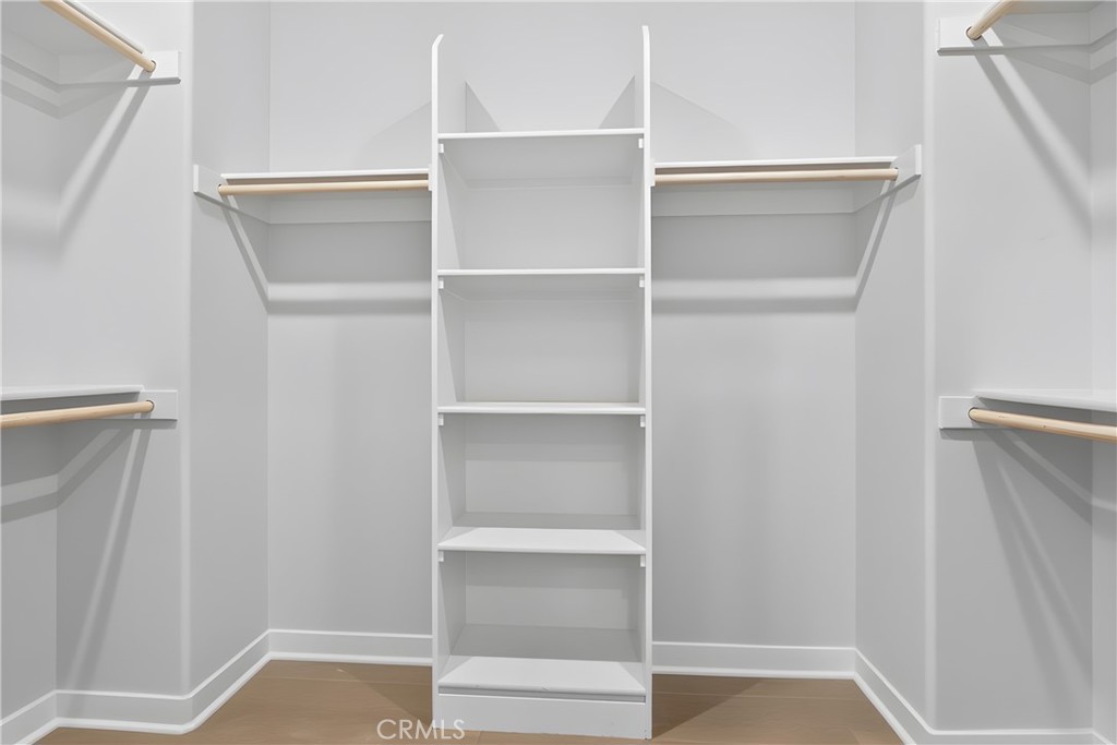 382 Chorus Irvine, CA 92618 - Photo 26 of 38 a view of walk in closet with empty racks