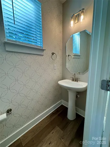 a bathroom with a sink and mirror