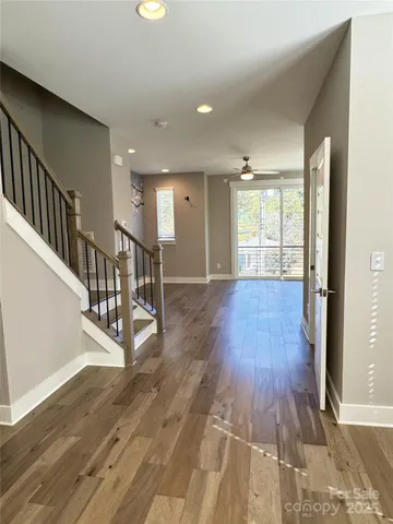 a view of an entryway with wooden floor