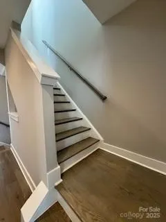 a view of an empty room with stairs