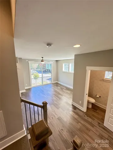 a view of an entryway with wooden floor