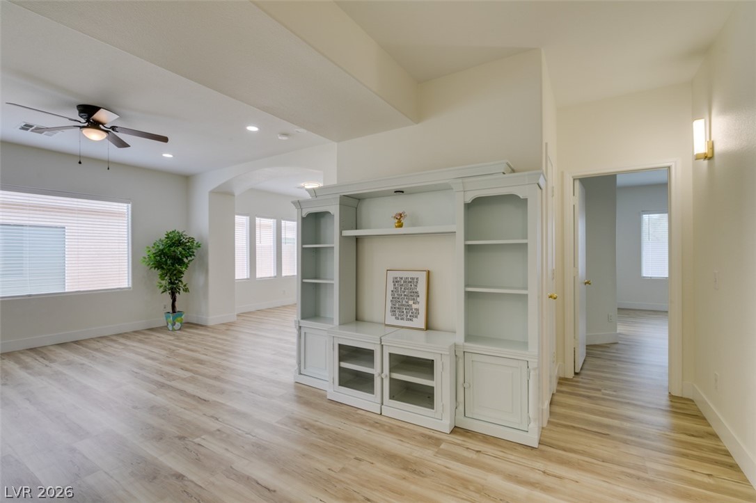 10959 Pumpkin Ridge Avenue Las Vegas, NV 89135 - Photo 9 of 51 Luminous living space features high ceilings and durable LVP flooring.