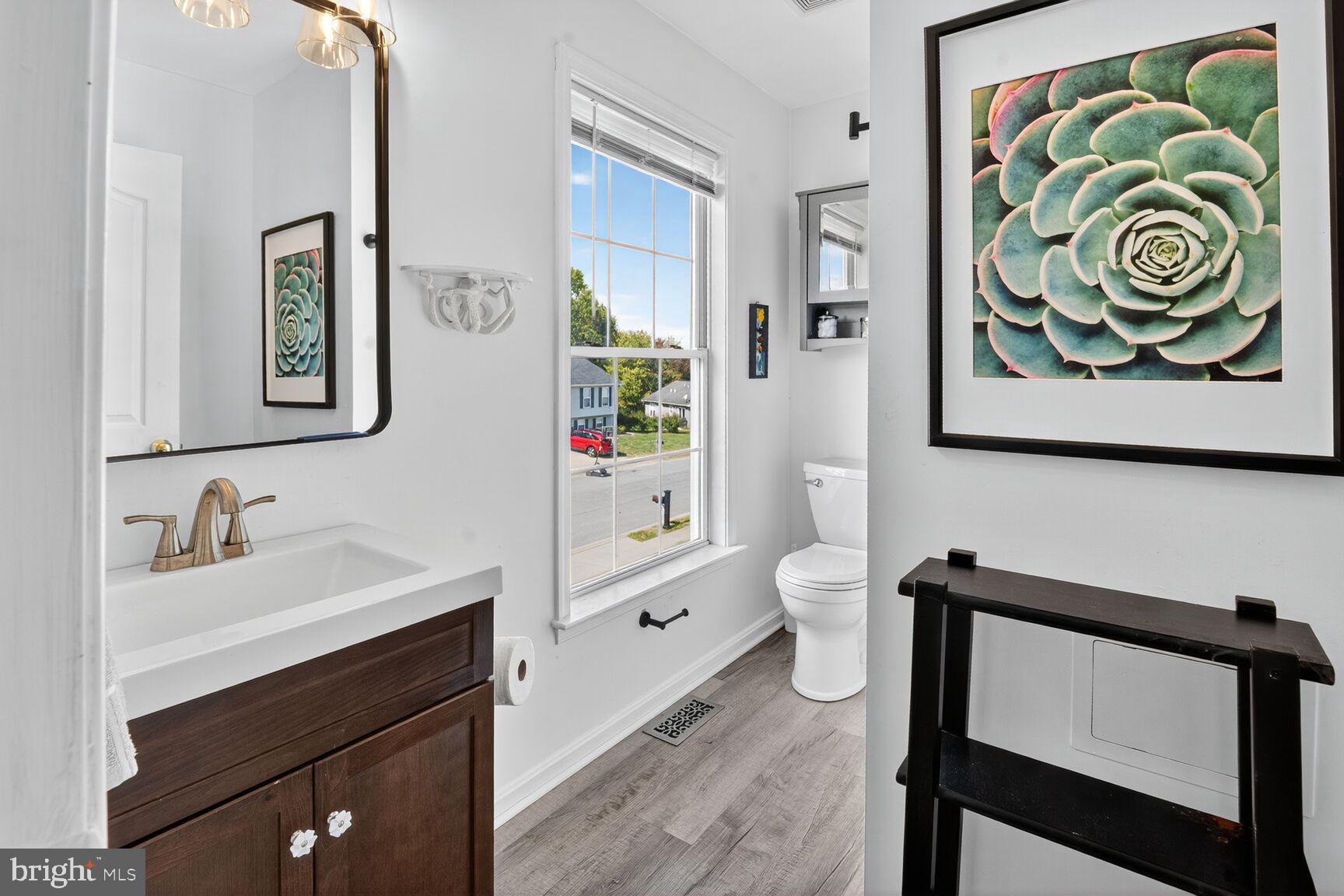 71 Fairground Avenue Taneytown, MD 21787 - Photo 14 of 36 a bathroom with a sink a toilet and a bathtub