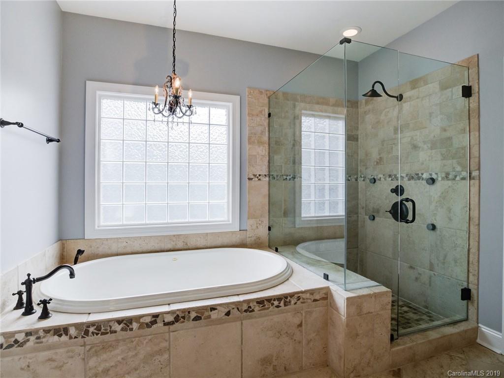 1502 Hubbard Court Fort Mill, SC 29708 - Photo 24 of 36 a bath tub sitting next to a shower