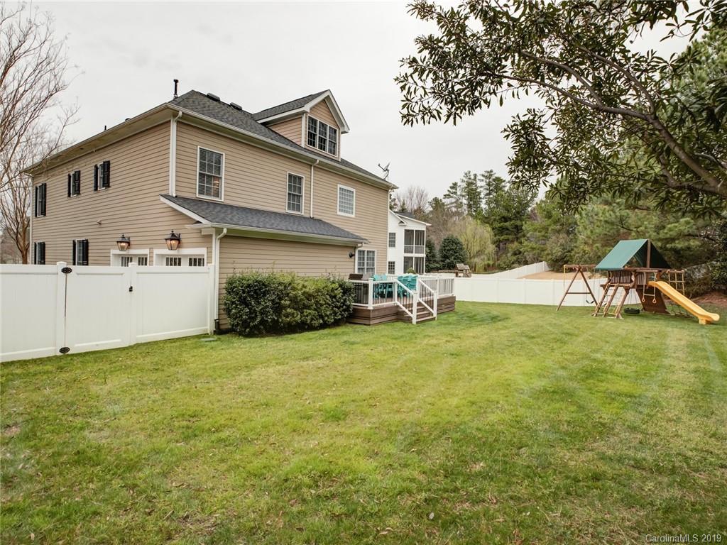 1502 Hubbard Court Fort Mill, SC 29708 - Photo 33 of 36 a view of a house with backyard and garden