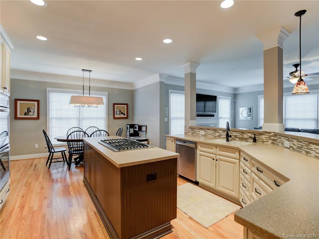 1502 Hubbard Court Fort Mill, SC 29708 - Photo 10 of 36 a kitchen with stainless steel appliances granite countertop a sink stove and refrigerator