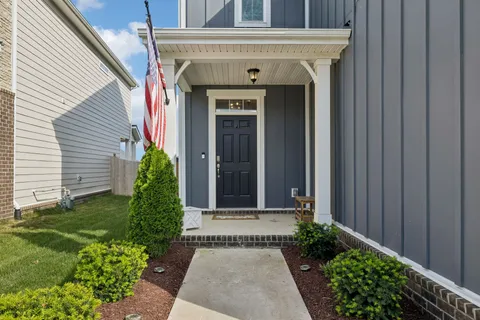 a front view of a house with garden