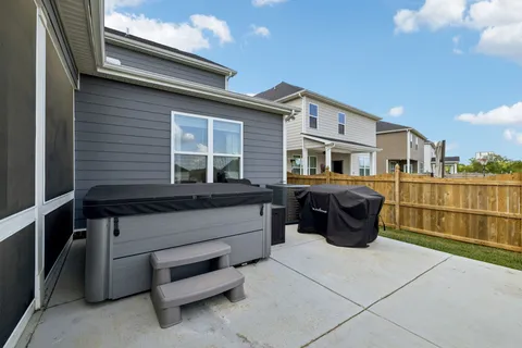 a view of a house with backyard and porch