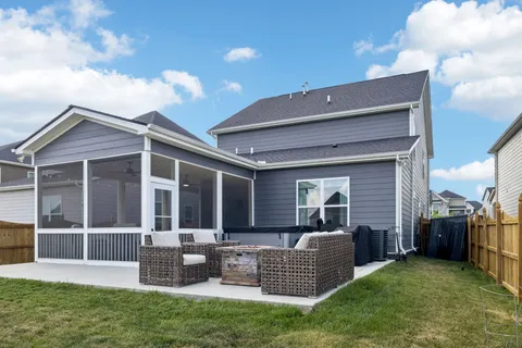 an aerial view of a house with swimming pool outdoor seating and city view