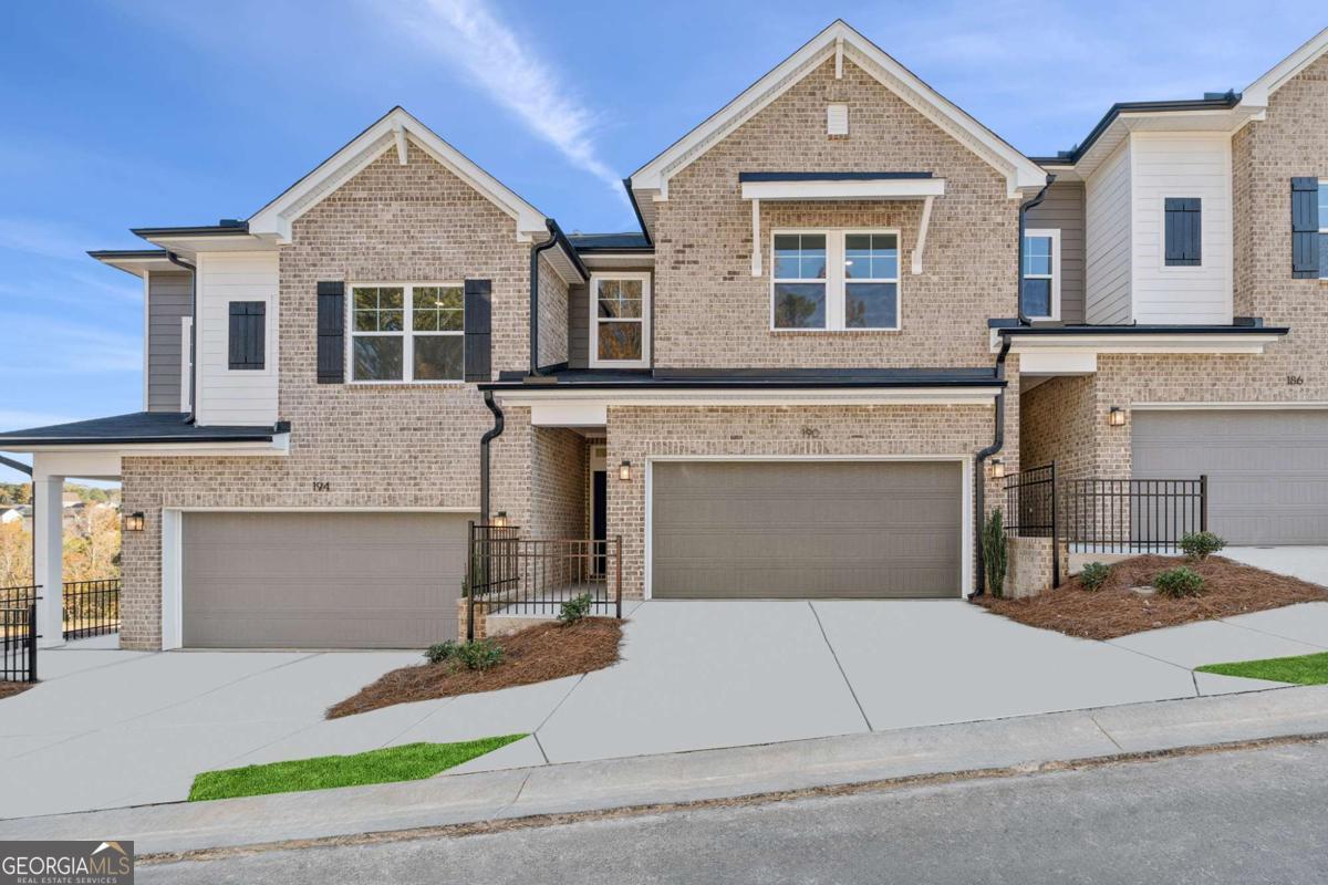 a front view of a house with yard