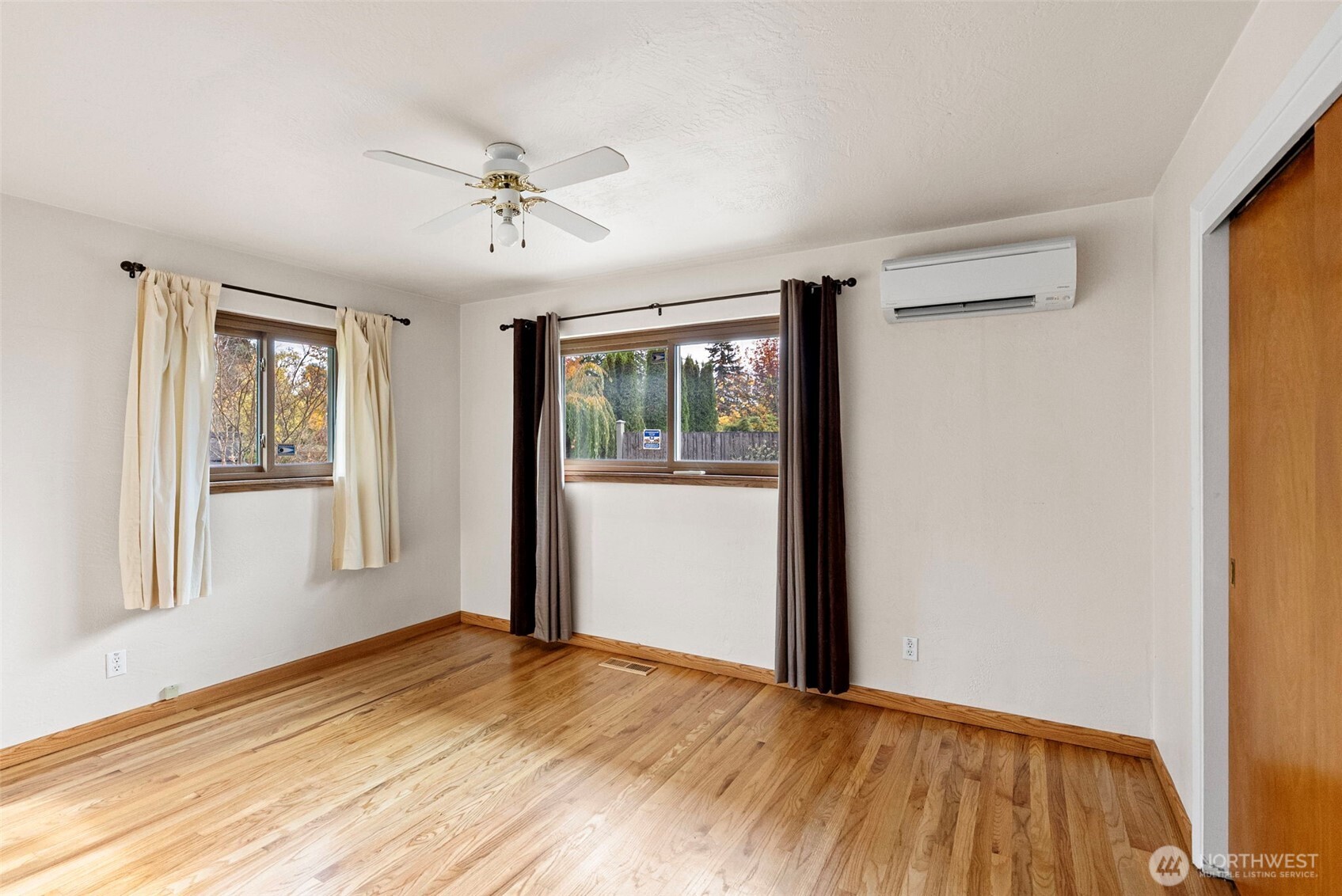 2821 Sanders Avenue Bremerton, WA 98310 - Photo 20 of 40 a view of empty room with wooden floor and fan