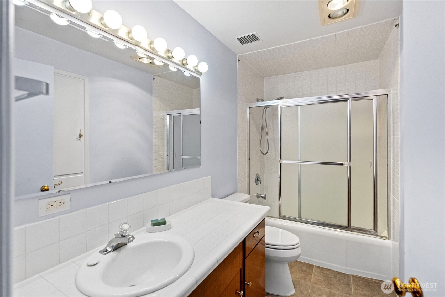 2821 Sanders Avenue Bremerton, WA 98310 - Photo 22 of 40 a bathroom with a sink a toilet and shower