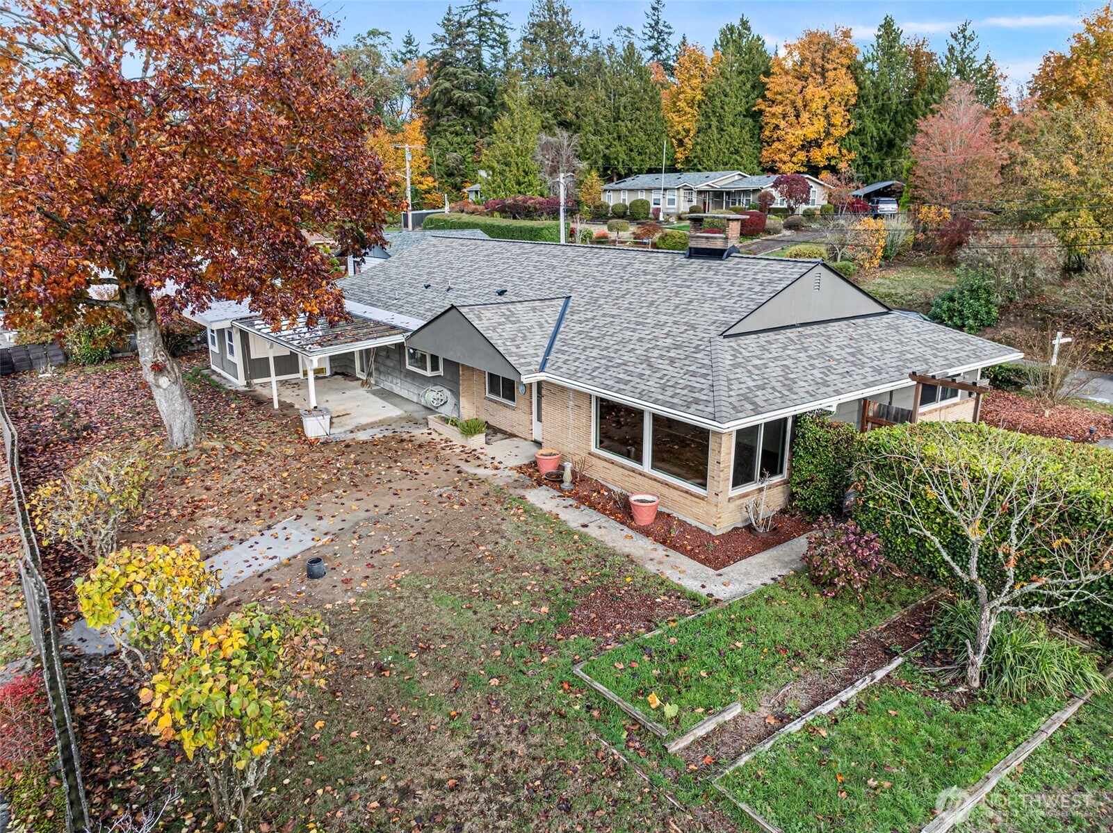 2821 Sanders Avenue Bremerton, WA 98310 - Photo 30 of 40 an aerial view of a house with garden space and trees