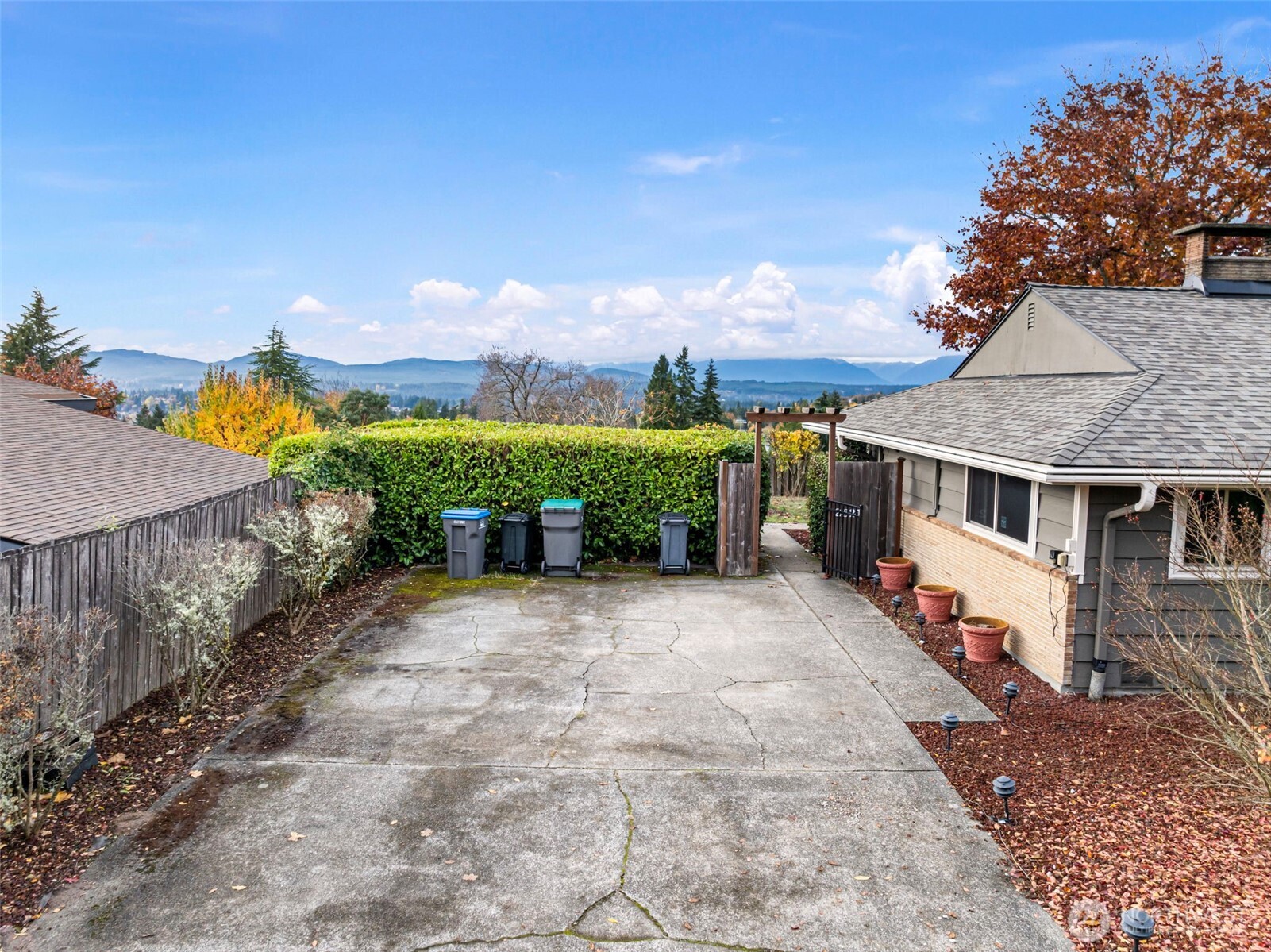 2821 Sanders Avenue Bremerton, WA 98310 - Photo 34 of 40 a view of a house with a yard and potted plants