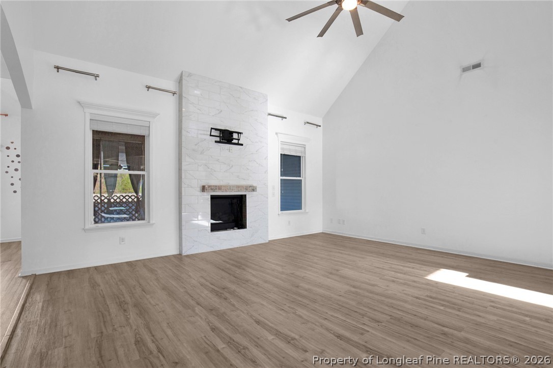 2145 Harrington Road Fayetteville, NC 28306 - Photo 11 of 50 an empty room with windows and fireplace
