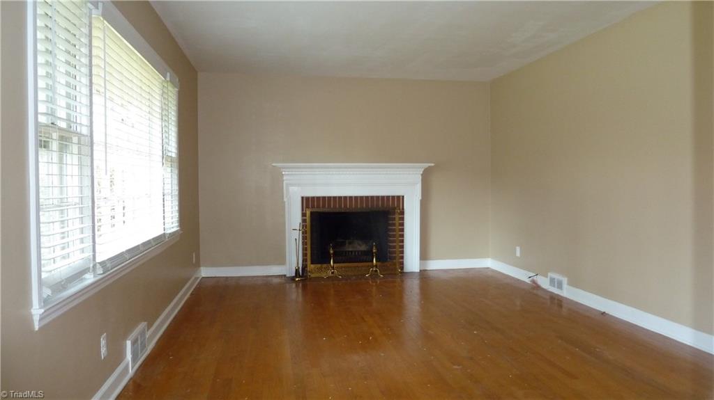 2107 Independence Road Winston-Salem, NC 27106 - Photo 4 of 20 Living Room w/wood burning fireplace