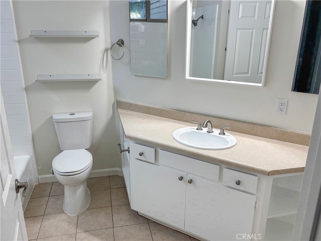 1445 Prefumo Canyon Road, Unit 20 San Luis Obispo, CA 93405 - Photo 12 of 19 a bathroom with a sink toilet and a mirror
