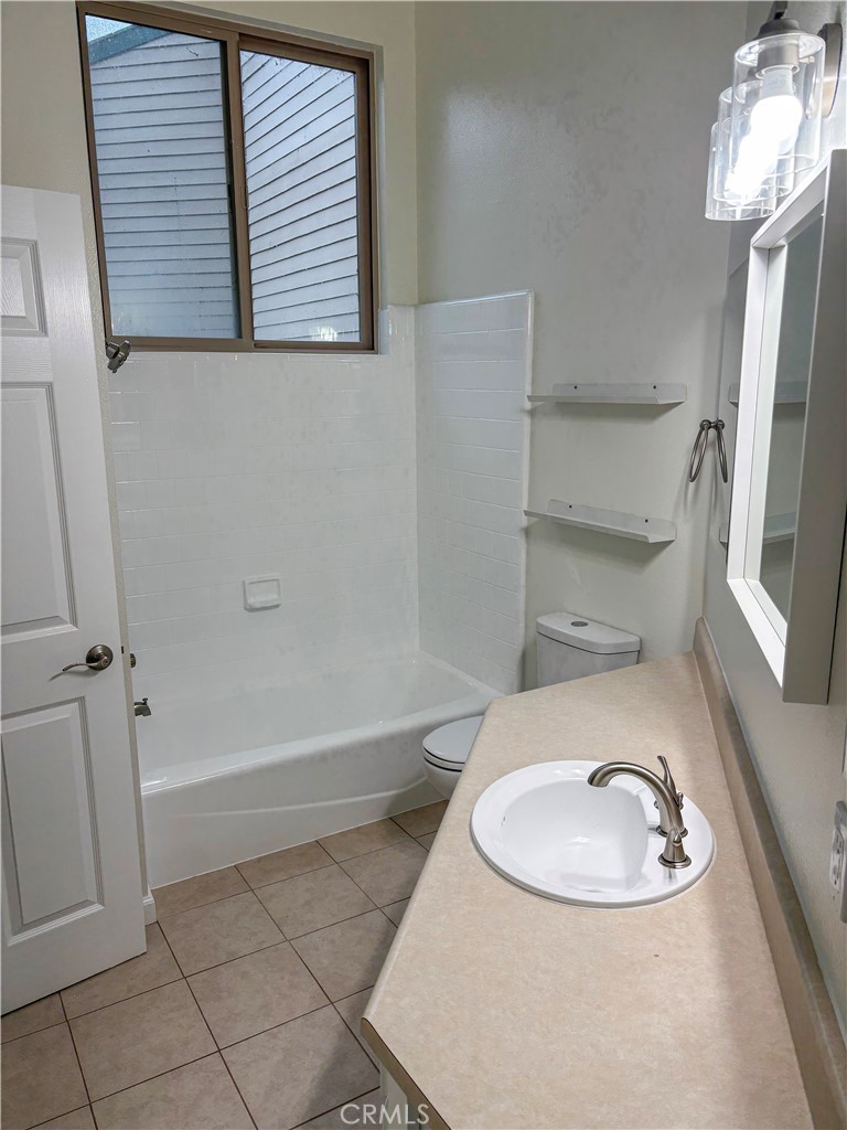 1445 Prefumo Canyon Road, Unit 20 San Luis Obispo, CA 93405 - Photo 13 of 19 a bathroom with a sink and a mirror