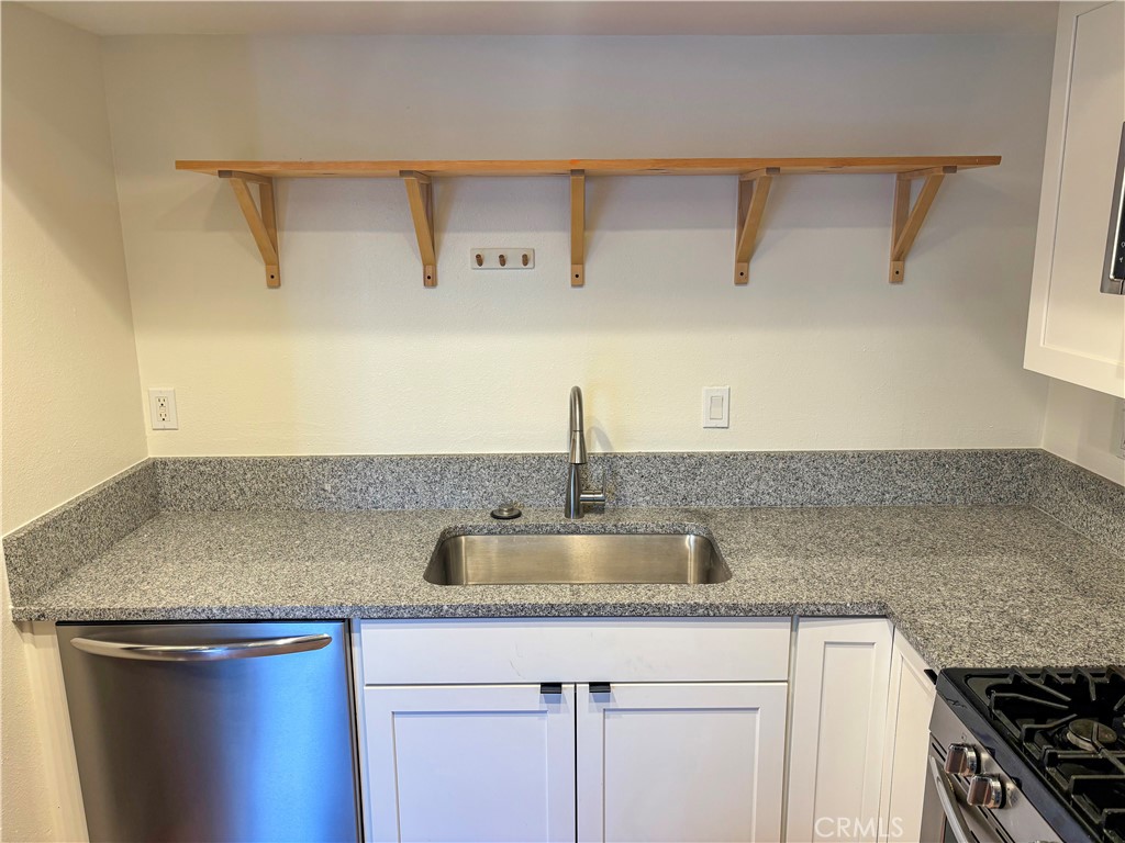 1445 Prefumo Canyon Road, Unit 20 San Luis Obispo, CA 93405 - Photo 5 of 19 a kitchen with a sink and cabinets
