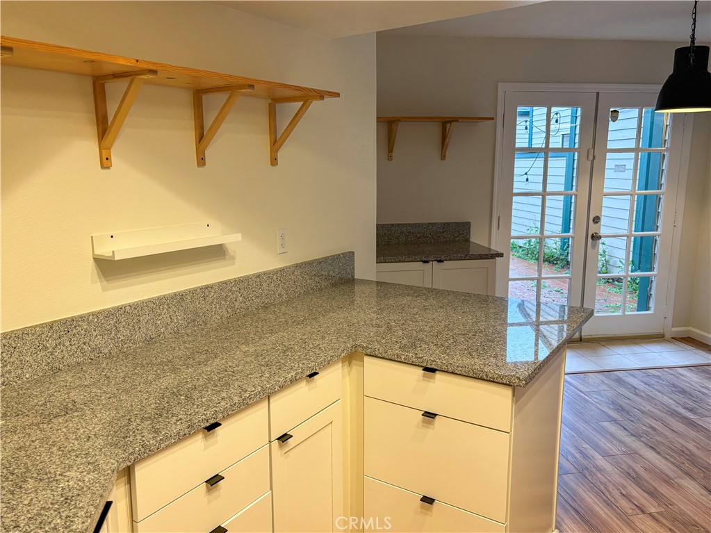 1445 Prefumo Canyon Road, Unit 20 San Luis Obispo, CA 93405 - Photo 7 of 19 a kitchen with kitchen island a counter top space and a sink