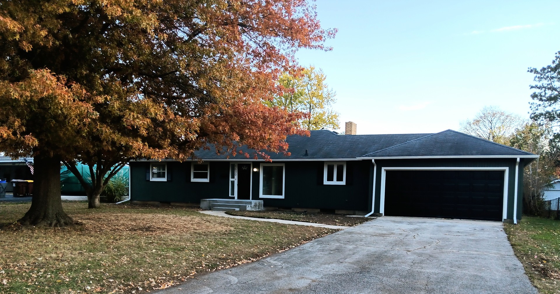 1630 Jonathan Avenue Rockford, IL 61103 - Photo 1 of 23 a front view of a house with a yard and garage